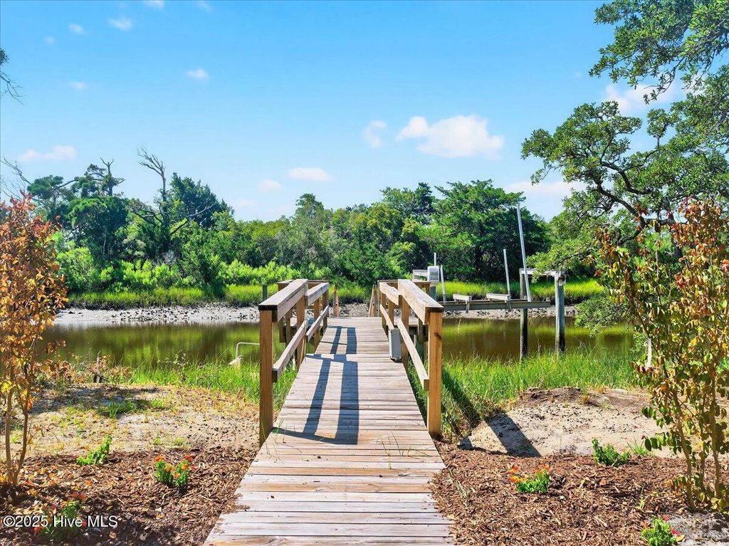Photo of 117 SE 4th Street, Oak Island, NC 28465 (MLS # 100520195)