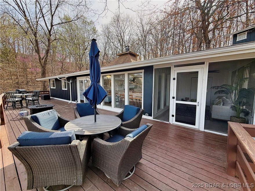 Back on the market, Buyer unable to proceed — opportunity reopened. Completely remodeled in 2023, this 4BR/3BA lakefront home offers ~2,040 sq ft of turn-key living at the 36 MM of the Osage Arm. Three bedroom 2 bathroom main house. Enjoy panoramic sunset views from the expansive deck, a gentle walk to your private dock, with private boat ramp and modern upgrades throughout: newer HVAC, PEX plumbing, kitchen with custom cabinets & appliances, and more. A detached 2-car garage with 1BR/1BA apartment adds guest or rental income potential. Located just minutes from popular lakefront dining by water or land, this property is ideal for both personal lake living and investment. Property features a smaller dock in a shallow, protected cove. Best suited for buyers who enjoy swimming, paddle sports, and a quieter cove environment rather than large cruisers.