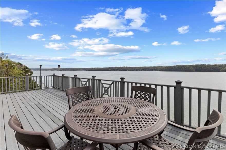 A stunning waterfront retreat in the desirable Tan Tar A Estates—perfectly positioned next to Margaritaville. Enjoy access to resort amenities including a swim-up bar, lakeside bar & grill, billiard room, arcade, spa, restaurants, marina, and more—bringing vacation living right to your doorstep. FREE golf and 9 miles of scenic beauty in this golf cart community provide unmatched value and recreation. This beautifully designed home features an open-concept layout filled with natural light, showcasing breathtaking main channel views. The spacious living area flows effortlessly into a well-appointed kitchen with modern appliances, ample cabinetry, and a large island—ideal for entertaining. The home offers multiple bedrooms and bathrooms, each a relaxing primary suite with private outdoor access and stunning waterfront views. Whether hosting guests or enjoying a quiet weekend, every space is designed for comfort and connection. Centrally located by land and water near top attractions. Whether you’re searching for a weekend escape, full-time  residence, or rental income, this is the ultimate Lake of the Ozarks experience—where every day feels like a vacation. Boat slips available