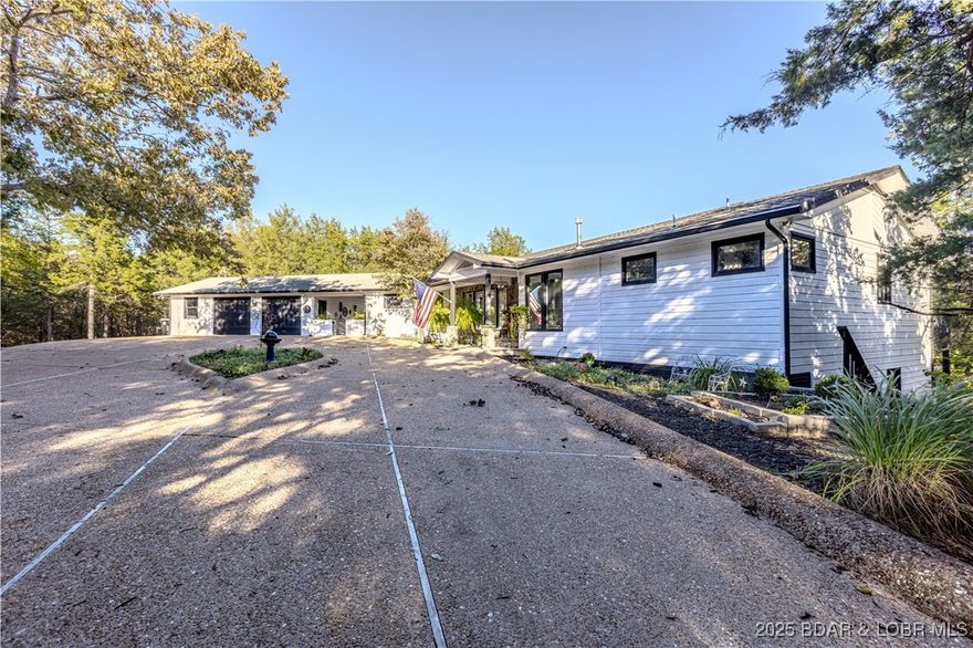 BACK ON MARKET AT NO FAULT OF SELLER.  This 4000+ square foot home was built with luxury in mind.  New roof, ready for a new family, in the best location!   The 4.5 acres of privacy within 2 minutes of Lake Valley Golf Course and about 4 minutes to Kinderhook Golf Course makes this location a dream for every golfer.  Only minutes from the city center of Camdenton boasting  a beautiful lake view and a coveted location that highlights an area of upscale homes.   From the minute you walk in the door the large windows cast such a beautiful natural light in the great room and kitchen.  An office turned music room is perfect for a Baby Grande Piano, with a new sunroom features a cozy nook right off the kitchen.  Additionally the breezeway attaching the garage to the house has been transformed into the perfect place for your outdoor kitchen and covered outdoor dining area.  The kitchen being something dreams are made of with 2 full size refrigerators and the massive center island that is the heart of this home.  This is the perfect place to park a boat or build another garage for your RV and boat storage.  A golf cart ride to Lake Valley Country Club, and a community dock down the hill.