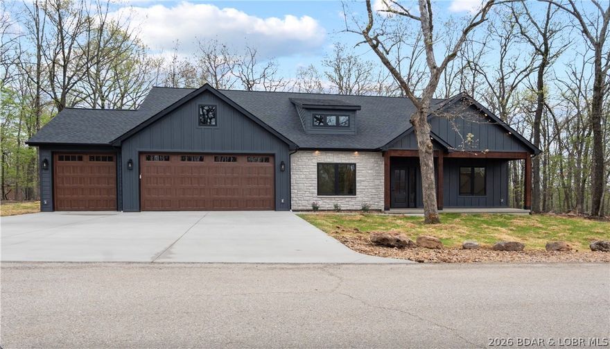 Discover your Porta Cima retreat — a single-level ranch home offering effortless living and exceptional privacy. This inviting 3-bedroom, 3-bath residence sits on a hard to find flat, wooded lot and features an oversized 3-car garage perfect for boat trailers or a work bench area, covered front and back porches ideal for morning coffee, and a versatile bonus office perfect for remote work or a hobby room. The ranch-style floor plan provides easy one-level flow with a spacious primary suite and ample storage, while private wooded views create a tranquil setting on a quiet street. Enjoy quick access to dining, shopping, marinas, and recreational amenities at the Lake of the Ozarks. Comfortable, private, and ideally positioned for lake life.