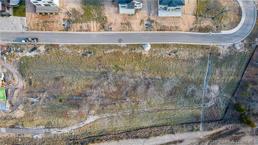 Welcome to Harpers Cov- Osage Beach's newest Lakefront, Lakeview/Lake access Subdivision located off the 18 mm of the Osage Arm. Ideal location by both land & water-only minutes by the best amenities the Lake of the Ozarks has to offer. This subdivision has great momentum- new construction homes, villas and new homeowners already enjoying Harpers Cov. Enjoy the Subdivision Lakeside pool with clubhouse, paved streets w/curbs & sidewalks, fiber optic internet, natural gas, city water & sewer, community trash & street lights. Don't miss the community park area by the Elephant rocks- a true site all by itself! Golf cart friendly with paths in place down to the community pool and docks in place (more coming soon). Build your own custom home today! Builders welcome. Numerous boat size slips available. This is what everyone has been waiting for, a centrally located place to enjoy the Lake life. Each buyer is asked to contribute $1500 towards the reserve fund at closing.