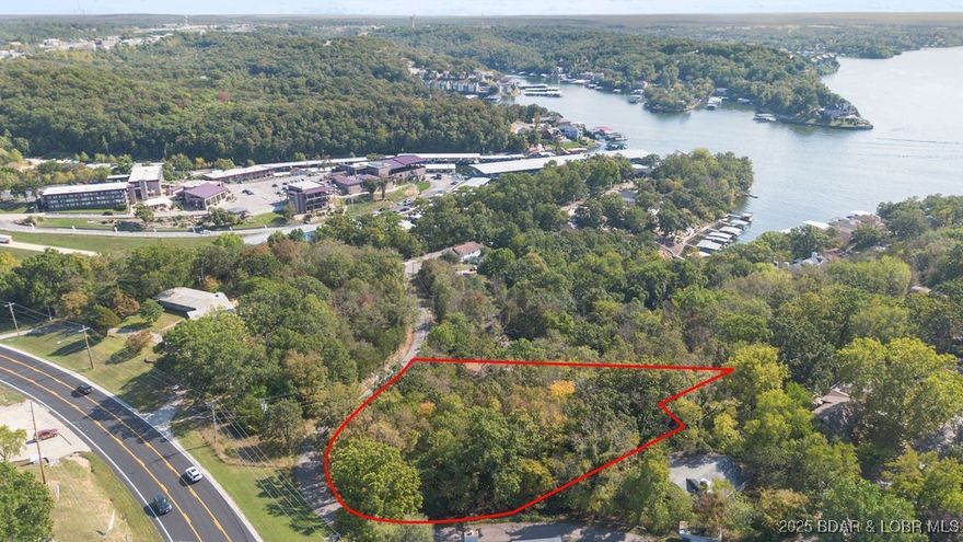 Prime opportunity in Arrowhead Beach! This .95-acre lot offers city water and city sewer and sits in a desirable, high-visibility location surrounded by growth and development. With nearly an acre of usable ground, this property provides excellent potential for future use—whether you’re planning a new venture, an investment project, or a strategic build site