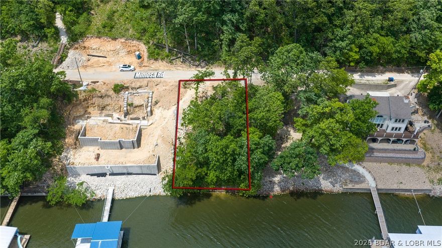 This .19-acre lakefront lot in Rocky Mount is an ideal canvas for your dream build. Situated on deep water, it offers excellent cove protection—so you get both serene, sheltered views and direct access to the main channel. Utilities are ready at the street, and with the Bagnell Dam Strip just minutes away, you’ll enjoy both privacy and convenience. Don’t miss this rare opportunity—bring your builder and start planning today!