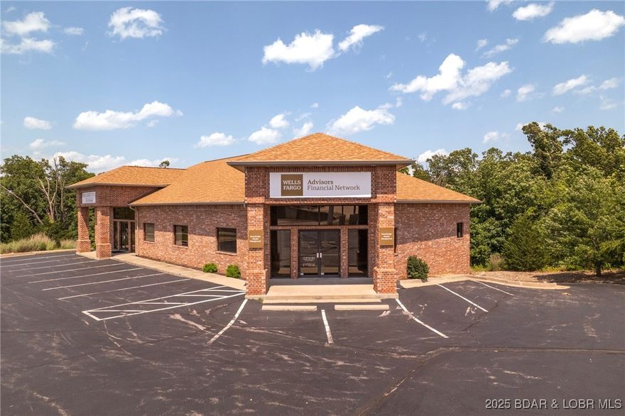Prime Commercial INVESTMENT OPPORTUNITY. This well-maintained commercial office building has four individual office spaces, three are currently leased to long-term occupants. Ideal spot for professional use such as an attorney's office, medical or administrative services.  This location has ample parking and easy highway access. Built in 2007, the brick construction offers low maintenance investment potential. Adjacent lot is also listed (MLS#3578481). Sellers would consider a package offer.