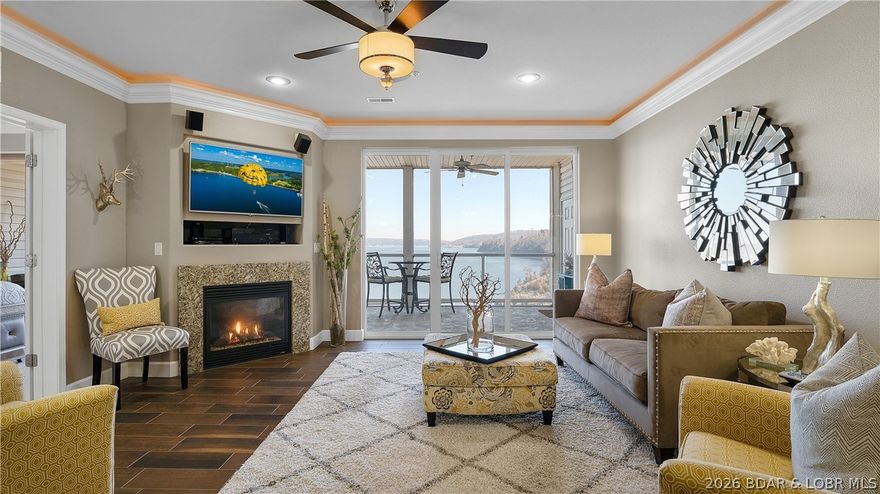 Exquisitely decorated 3-bedroom 2 bath turnkey lakefront condo where style and comfort meet effortless lake living. The open living space showcases porcelain tile floors, granite countertops, stainless appliances, fireplace and softly illuminated crown molding creating a warm, upscale ambiance throughout. Step onto the patio and take in the panoramic lake view, the perfect backdrop for morning coffee or evening unwinding. Enjoy the heated lakeside pool, or head straight to the water to your 12x32 boat slip with lift; optional PWC slip available. Perfectly located by land and water, this is the ultimate lake getaway or full-time lake home.