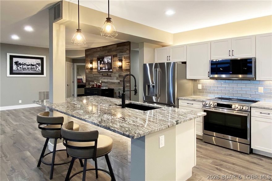 COMPLETE renovation in 2026 at Evergreens Condo - nestled between Porto Cima and The Villages, 100% new top-to-bottom, high-grade throughout. This 1705 sq ft 3-bedroom 3-bathroom condo is one-level living at its best. New HVAC, kitchen / "D" grade granite throughout / LVP flooring / LG appliances, water heater and softener, furniture, bathrooms, electronics, and the list goes on. The huge main-channel view on the 18MM allows you to watch all of The Lake activity and speed boats on a daily basis, while the comforts of "new construction" assure you of top-quality and the simplicity you'd expect in this type of lifestyle. 9-ft ceilings, open layout, fully-furnished turn-key property, close to countless restaurants by water AND road. Only 68-units in the complex, private pool, tennis, NO Rentals. Private garage with new epoxy floor coating, and a 12x28-ft boat slip. Manicured greenspace is "pet friendly" and also an abundance of groomed areas for kids and family. Additional roll-over parking for cars and boat trailers. Screened-in deck is 450 sq.ft. (43-ft wide), more than ample room for large gatherings. Give us a call today, thank you.