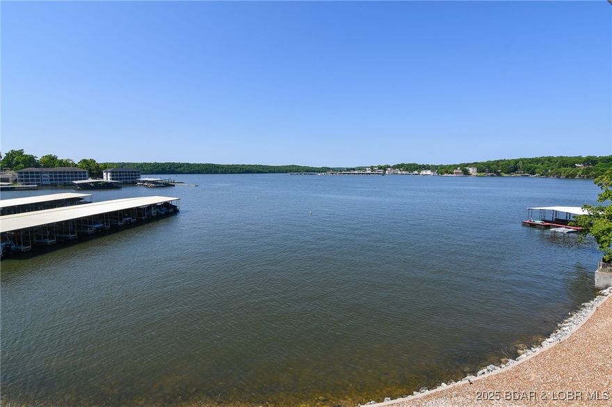 LOCATION, LOCATION, LOCATION!! And VIEW, VIEW, VIEW!!! Look one way and see the Grand Glaize Bridge and look the other and view the Main Channel of the Grand Glaize Arm with the community pool below you. This 1 Bedroom 1 Bath top floor condo is perfectly located for convenience, with all you need close by. Fully furnished- stocked kitchen and stacked washer/dryer.  Relax on the deck and watch all the boats and water activities.  You can also view your 10x 24 boat slip with lift from deck.  2 PWC spaces with lifts included. The new salt water pool is right there for afternoon swims and sunbathing. New roofs.  Being just off the 19 Mile marker of the Main Channel makes it super easy to get to waterfront restaurants like Margaritaville, Dog Days, Backwater Jacks and more. Easy to boat to the State Park and quieter Glaize Arm, Flower Pot Cove and beyond!! BE READY FOR SUMMER! Call today!