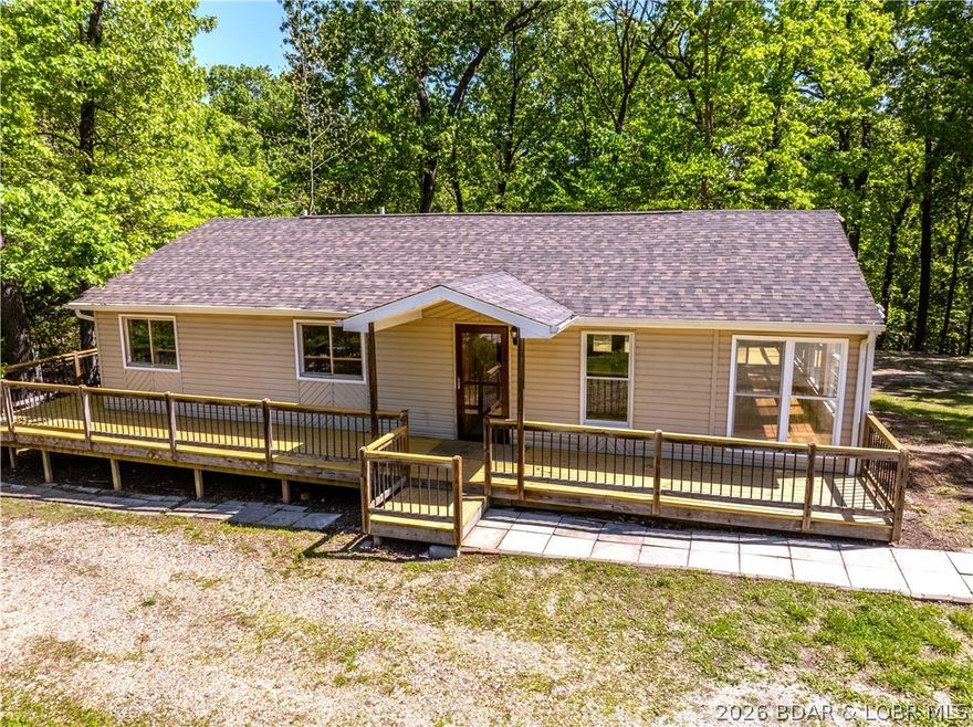 Completely remodeled and move-in ready, this Rocky Mount home offers the perfect blend of quality upgrades, functional living & a great location—just 10 minutes from the Bagnell Dam Strip and 15 minutes to Osage Beach. This 3bed/3bath, approx. 1,700 sqft home features main level living with vaulted ceilings, abundant natural light & a spacious sunroom off the living room. One of the standout features is the newly rebuilt oversized deck off the back of the home that wraps around to the front, creating excellent outdoor living space. Major upgrades include a new roof, heat pump HVAC, new 1,000 gal septic tank, remodeled kitchen with new appliances, fresh paint, updated fixtures, relocated electric panel, multiple new windows & new crawlspace vapor barrier. Primary suite includes a private bath with walk-in shower & soaking tub. Exterior offers a flat backyard, circle driveway & additional space beside the home ideal for a future shop or garage. A rare turn-key opportunity with extensive improvements already completed!