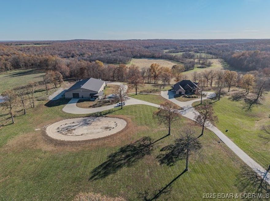 THIS is a ONE of A KIND PROPERTY and one of THE MOST BEAUTIFUL SETTINGS in THE AREA !! THIS CUSTOM BUILT HOME is SETTING ON 19.8 ACRES W/Large Scattered Trees, A POND. FULL BRICK & STONE HOME with fuLL finished WALK OUT BASEMENT, WONDERFUL VIEWS ,VERY OPEN CONCEPT LIVING and QUALITY IS THE WORD fromThe GROUND UP. New IN-GROUND POOL in 2023, NEW POOL HOUSE, This HOME HAS OVER 5400 SQ FT ML OF FINISHED LIVING SPACE, 3 CAR ATTACHED GARAGE. THE MAIN LEVEL OFFERS A LARGE LIVING ROOM W/FLOOR TO CEILING STONE FIREPLACE, Hardwood flooring throughout, Tile in The Baths, LARGE KITCHEN DINING AREA, CENTER ISLAND, GRANITE COUNTERS THROUGHOUT. A GREAT ENTERTAINING AREA, REAR COVERED PORCH, On the Main level has 3 BEDROOMS, 3 1/2 BATHS, HOME OFFICE, a DOG SHOWER ROOM. MASTER HAS A FIREPLACE, LARGE BATH W/CUSTOM TILE SHOWER, in all MAIN LEVEL BATHROOMS, LOWER level THEATRE AREA, VERY LARGE BAR, BEDROOM #4, w/ A FULL BATH, + 1/2 bath. W/urinal, SAFE ROOM. LARGEST HOME SHOP IN THIS AREA OVER interior 10,000. SQ FT w/SHOP space.11,620 sq ft w/porches, 2 LARGE OFFICES, a FULL BATH, LAUNDRY AREA, POLISHED CONCRETE FLOORS, 14 FT OVER HEAD DOORS, COVERED PORCHES, 2 HVAC SYSTEMS in shop, Built in 2018