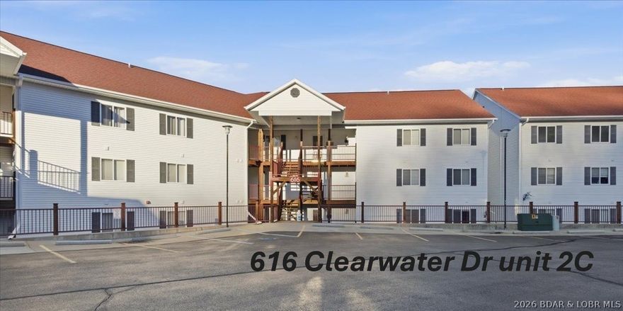 Clearwater Condo, located at the 8.5 mm of the Big Niangua in Camdenton, MO, at Lake of the Ozarks. Enjoy morning sunrise & afternoon shade. This waterfront condo includes a 12 x 32 boat slip with hoist on a cove-protected community dock. Featuring 3 bedrooms, 2 bathrooms, laundry area with washer/dryer. Kitchen has white cabinets, full-size refrigerator, dishwasher, microwave, & countertop dining area. The family room boasts a corner gas fireplace, stunning main channel views, & a sliding glass door leading to a large deck with a finished ceiling & ceiling fan. The owner’s suite offers a walk-in closet, private bath with dual sinks, & a sliding glass door for waking up to beautiful views every morning. Just a few steps down from the parking lot on the 2nd level, it provides easy access to the boat dock & pool. Clearwater Complex features a custom-designed covered pavilion for gatherings at the firepit, volleyball, playground, & year-round neighborly get-togethers. There are 2 pools, one is even heated! This dog-friendly community has discreetly placed relief stations throughout the property. Nightly rentals allowed, however this unit has never been a rental.
