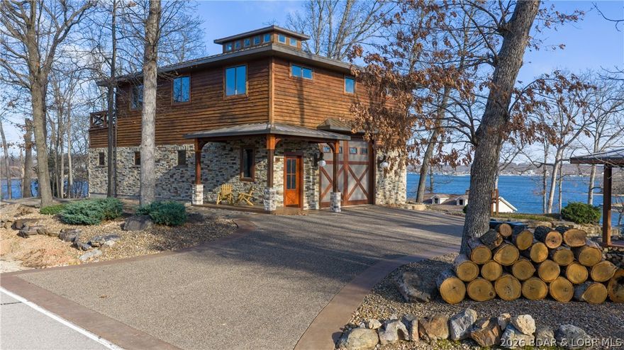 Unique home in Lake Ozark. Custom built Saltbox architecture house offers a unique aesthetic and an incredible panoramic view that will take your breath away every ordinary day.  Highly efficient geothermal heating and cooling system ensures year-round comfort with a significantly reduced carbon footprint, there are two wells on this property. The ultimate climate controlled garage awaits with radiant heated floors- talk about a ManCave! Enjoy morning coffee on the concrete deck while you soak in the shimmering water or hosting friends for a showcase sunset. This house has too many upgrades to describe.  Two large, airy bedrooms and 2.5 bathrooms, quartz countertops and KitchenAid appliances, gas fireplace, too many upgrades to list! You have to see the unique design and features for yourself.  Two 16 x 14 garage doors with commercial grade openers so you can drive right through. This property stands proudly in a league of it's own. Priced at recently appraised value. CALL YOUR REAL ESTATE PROFESSIONAL TODAY!