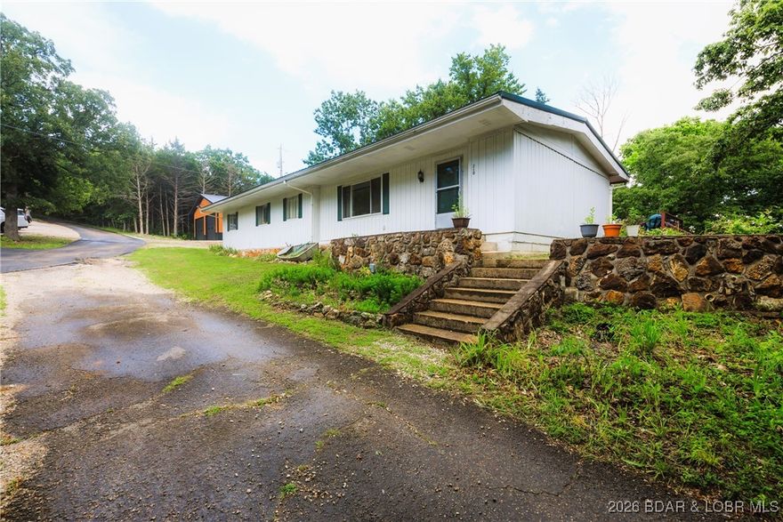 If you have been searching for a property that offers more than just a place to sleep, look no further. This 3-bed, 2-bath home situated on a massive lot that provides the elbow room you’ve been craving. Whether you envision a lavish garden or simply a place to park your boat trailers. The possibilities are endless. The heart of the "work-from-home" or "play-at-home" lifestyle is found in your 30x30 metal shop. Ample space for woodworking, automotive restoration, or storing personal watercraft, this shop is a rare find. Complementing the shop is a 10x26 boat slip, providing you with access to the water & endless summer adventures. Inside, LVP flooring flows through the high-traffic areas, offering easy maintenance w/ a contemporary feel, bedrooms have been upgraded w/ new carpet. The floor plan includes a bonus room, allowing you the flexibility to customize—be it a formal dining room, game room, playroom or home office. The outdoor living space offers a large wooden deck, perfect for morning coffee or hosting evening BBQs. Whether you are looking for a primary residence with room for your business and hobbies, or a vacation getaway, this seller is motivated, Bring an offer today!