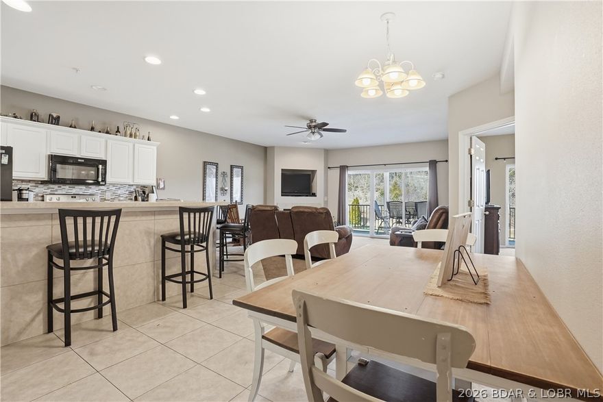 This spacious 5-bedroom, 3-bathroom two-story condo located in the highly sought-after gated Cedar Heights community! Being offered fully turn-key, this property is ready for immediate enjoyment or rental income from day one. With two levels of living space, this condo offers the perfect setup for both relaxing and entertaining. The main level features a screened-in upper deck ideal for enjoying the outdoors in comfort while the lower level opens to an additional deck just steps away from one of the community pools. Inside, you’ll find ample room for guests with two separate living areas, including a lower-level game space complete with a pool table, making it a standout option for short-term rental potential or hosting family and friends. If you’re looking for a strong investment opportunity or a full-time lake home with room to spread out, this property offers it all. This complex offers a peaceful, private setting while still being conveniently close to town. This unit also includes a 12x30 boat slip perfect for enjoying everything lake life has to offer. Don’t miss your chance to own a versatile, income-producing property in one of the lake’s most desirable communities!