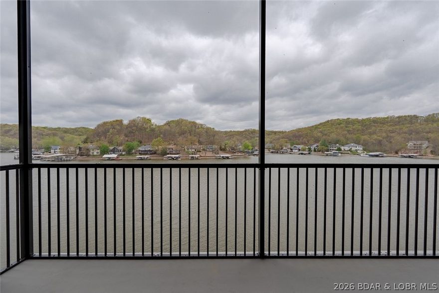 Top-floor living at its best. This Ember Ridge condo features 24’ ceilings and breathtaking lake views that truly set it apart. Located just steps from the elevator, this unit offers both convenience and a sense of exclusivity. The open-concept layout is designed for entertaining and everyday comfort, complete with 3 full bathrooms, three large bathrooms, and a large pantry. Built with rare steel construction and finished with a clean, modern design, this brand-new condo stands out from anything else at the Lake of the Ozarks. Ideally located near several of the lake’s most popular waterfront restaurants and attractions. Dock slips and PWC slips available. Perfect as a luxury getaway or high-demand vacation rental. Photos are of Model Unit #205 and used to showcase design and finishes—you will have to see this one in person!