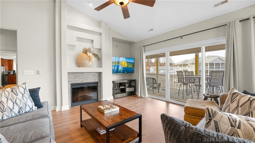 Top-floor living meets the ultimate lake lifestyle! This stunning Lake Ozark condo offers a rare and sought after layout featuring vaulted ceilings that create an open, airy atmosphere you won't find on lower levels. Dont forget the spacious master ensuite plus two additional guest ensuites, providing every bedroom with its own private bath. Freshly updated in 2024 with new flooring in the main living areas, fresh paint throughout, new mattresses, new living room furniture.  This unit is truly turn key and comes fully furnished.  Enjoy the outdoors from your large screened in patio or the adjoining open deck and yes, the patio furniture stays!  Featuring 14x40 boat slip and two PWC slips. Complex has a clubhouse, trailer parking, pool, and you can swim off the docks. Timberlake Village Condo is located in Lick Branch Cove at 5MM. Whether you're looking for a full time residence or the perfect vacation, this one checks every box.