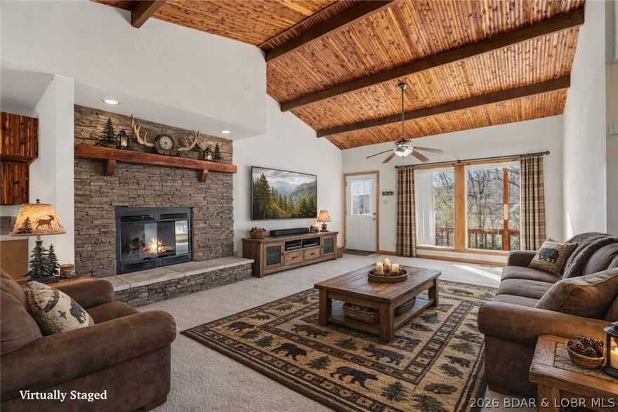 Situated on 3/4 of an acre in a private setting, this charming 3-bedroom, 2-bath home offers the perfect blend of peaceful country living and everyday convenience, located just off Highway 5. Built in 2010, the home features over 1,500 square feet with an open-concept layout designed for comfortable living and entertaining. Inside, you’ll love the beautiful stone fireplace,  and stunning wood vaulted ceiling detail that carries through the dining room, kitchen, and living room. The spacious kitchen comes with beautiful cabinetry, and the large laundry room adds extra functionality. The primary suite includes a jetted tub for a relaxing retreat at the end of the day. Outside, the adorable front porch creates a warm welcome, while the log-front exterior with vinyl siding on the sides adds character and low-maintenance appeal. A garage, community water, low taxes, and an affordable price point make this property an exceptional opportunity for buyers seeking space, style, and value.