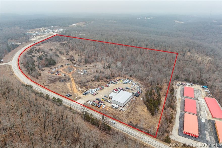 ZONED B-2 is this 24.17 acres that adjoins the Ozarks amphitheater with a 50x80 shop that has a 24x30 office. shop building offers   Mini split in office and central HVAC in shop building, all metal framing and 4- 12x14 overhead doors. Very versatile property fronting old HWY 5 with easy access to new Hwy 5.  Not many properties this close to town zoned B-2 available with this kind of opportunity. Shop is currently rented and bringing in $3250 a month. Many different business ventures could thrive here!