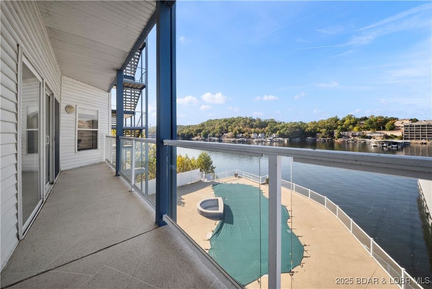 Discover the perfect blend of comfort and lakefront charm in this beautifully turnkey 3-bedroom, 3-bath Monarch Cove condo, located at the 2 MM of Lake of the Ozarks. Coming completely furnished, this home invites you to relax and entertain with ease from the moment you step inside. The open-concept design showcases natural light and panoramic main channel views throughout. Step outside to the spacious lakeside deck to enjoy incredible sunrises, sunsets, and one-of-a-kind lake views. A 12x32 boat slip is included, ensuring easy access to endless days on the water. Enjoy the three community pools, plus a prime location close to dining, shopping, and the best of lake entertainment. Whether you’re seeking a weekend escape, a full-time home, or an income-producing property, this condo captures the essence of effortless lakefront living.