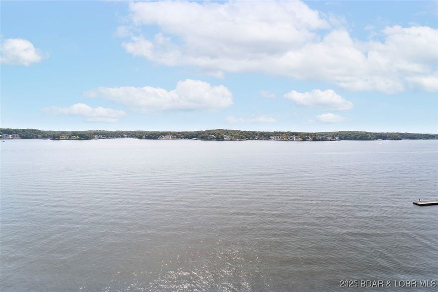 One of the most beautiful condos at the lake! Remodeled in 2018, this lovely penthouse condo has been gently used due to traveling owners that have the countryside to see! The most desirable floor plan at Palisades, you'll find it spacious with the most spectacular eagle's view that goes for miles. A major renovation took place in 2018: New luxury vinyl flooring, kitchen appliances, painted throughout, lowered bar height counter top and added Cambria Quartz counter tops that are absolutely gorgeous! New reverse osmosis drinking water, new bar with wine cooler, new lakeside Hunter Douglas blinds, new light fixtures and living room fan. Additional attic insulation was added and a new heat pump installed in 2020. 16 X 32 boat slip included and the closest designated parking space there is. Garage directly in front of condo is available to purchase as well as a 15,000 lb boat lift and 290 open bow SeaRay for sale with twin 6.2 engines. Ultimate condo package in the best location there is at the Lake of the Ozarks! Only minutes from town and centrally located at the 14.5 mile marker by water. Just bring your toothbrush and the family and enjoy this wonderful get-a-way.