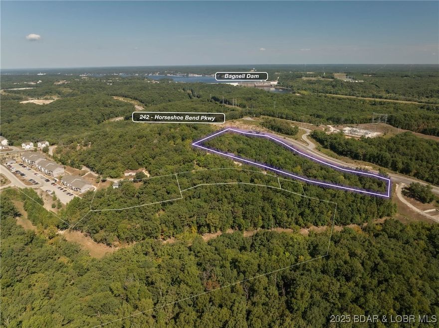 A little over 7 acres zoned commercial with Hwy 242 frontage.  In fact nearly 1000 ft of frontage with incredible visibility!  With that visibility, the correct zoning, water, sewer and electricity all close, this is the perfect location for a commercial business park or many other commercial ventures. Hwy 242 is the future of Lake Ozark and this spot is centrally located close to Osage Beach Parkway and The Bagnell Dam Strip. Only seconds from Menards, Kohls, the movie theater and everything else yet to be built on Hwy 242.  Tons of potential for varying business opportunities. If you want visibility and a central location, this 7 acres is something you need to check out. Lot is within the City of Lake Ozarks Tif district.