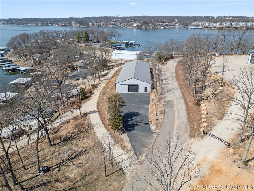 Boat Racer, Motor-coach or just too many toys this 6000 sq.ft 50x120' Commercial building is set up for your needs. Paved front parking secured with a gated entry and cameras to protect your stuff. Drive through concept with garage doors front and back. Out the backside of the building you are just a couple hundred feet from a subdivision launch ramp making your in/out for your watercraft or boats a breeze! Add a few windows and you have a lake view. Bring your toys or your business and join the fun at the Midwest Coast!