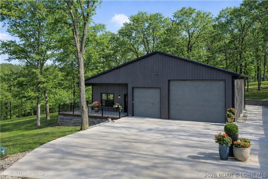 Need a place for your boat, RV, and lake toys but can’t find acreage near Lake of the Ozarks? This NEW CONSTRUCTION barndominium on 6.37 acres solves that problem. Located just minutes from town and less than a half mile from private lake access, this property offers the space and flexibility most buyers struggle to find. The property includes a finished 1-bedroom, 1-bath apartment with full kitchen, LVP flooring, washer and dryer, perfect for full-time living, weekend lake use, or staying comfortably while building your future home. Brand new well and septic. The heated and cooled 45-ft deep garage/shop features a 12'9" garage door plus an additional 10' door, giving you room for boats, RVs, trucks, and lake gear. A 50-amp RV hookup with sewer cleanout makes it fully RV ready. Mature trees create a private country setting while shopping, restaurants, and groceries are just minutes away. The property also includes plans for a future 3-bedroom home and a cleared build site already in place. Rare Lake of the Ozarks acreage with shop space, RV setup, and future home potential.