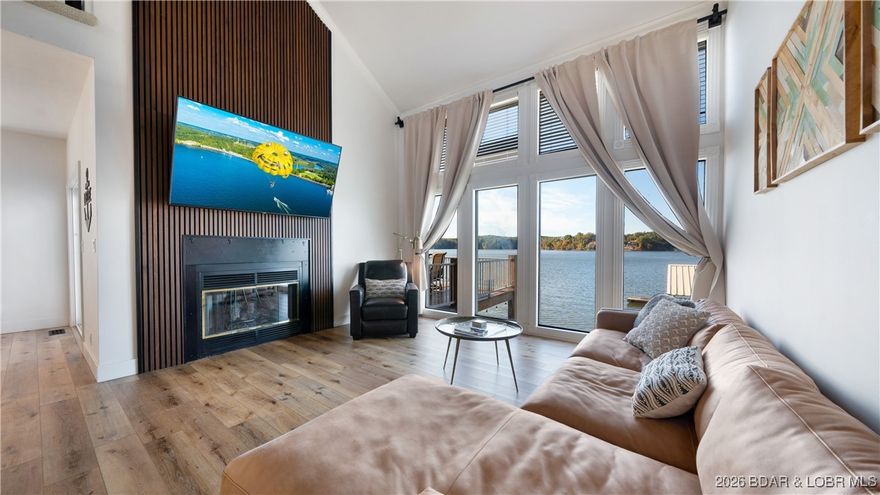 TURN-KEY lakefront living on a FLAT lot w/ HUGE view in the heart of Osage Beach AND a new roof bring installed! This newly remodeled home showcases panoramic views of the Osage 25 MM & features a large breakwater for easy docking & a 2-well concrete dock with 2 PWC spaces. Upon entering, you'll notice the vaulted living room that centers around a beautiful gas FP & flows seamlessly into the open-concept kitchen & dining area. Main level deck & lower lvl covered deck are crucial for entertaining. A spacious loft with two full/twin bunks functions as a 4th bedroom. Recent upgrades include a brand-new primary bath (Oct 2025), rebuilt main & lower decks with composite decking, new soffit, wrapped front posts, fresh exterior paint, new interior sliders, Bosch HVAC & a newer completely redesigned kitchen with new custom cabinets, countertops, appliances and backsplash. Additional improvements include new flooring, lighting, plumbing fixtures & updated fireplaces. An abundance of natural light highlights the incredible lake views from main level & lower level. Ideal home for a full-time residence, second home OR nightly rental investment—just minutes from the lake’s favorite restaurants.