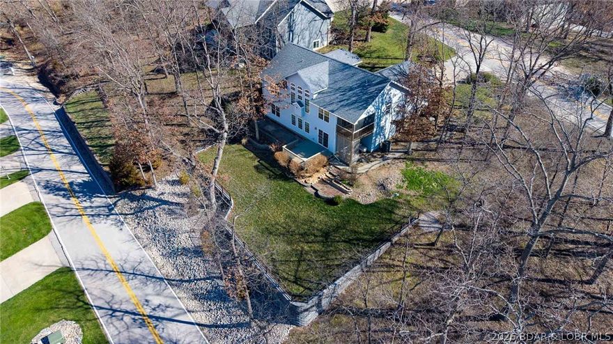 Rare opportunity to own a spacious home with lake view & dock access (12x36 slip w/hoist included!) in the highly sought-after Estates subdivision off HH. Offering 2,884 sq ft, 4 bedrooms, 3 baths, and a 2-car garage, this home is designed for full-time living with the bonus of a lake lifestyle. Truly main level living:primary suite plus an additional bedroom, full bath, laundry, kitchen & dining all on the main —an increasingly hard-to-find layout that works perfectly for families, guests, or multi-generational living. The bright kitchen & dining area open to a screened-in porch where you can unwind & take in year-round lake views. Step outside to a HUGE partially fenced backyard w/plenty of space to relax, entertain, or let pets and kids roam. This well-established community offers a pool, sewer, and trash service, creating a true low-maintenance lifestyle. Even better, the listing includes a golf cart and a coveted 12x36 boat slip w/hoist—giving you immediate access to the water without the upkeep of lakefront. Homes in this neighborhood offering this combination of space, layout, view, & dock access rarely come available at this price so don’t miss your chance to make it yours.