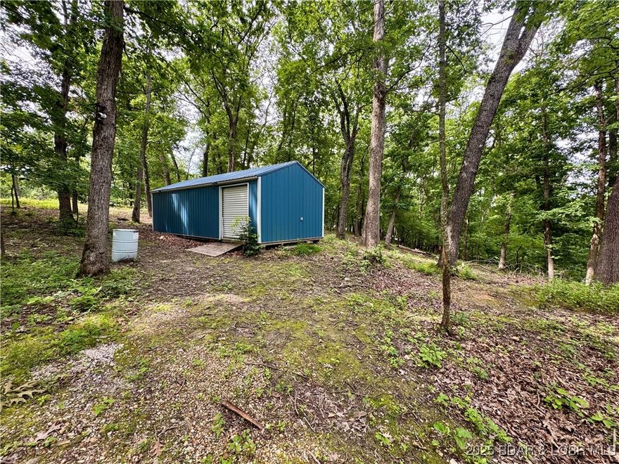 3.57 Acres with utilities and a storage building!