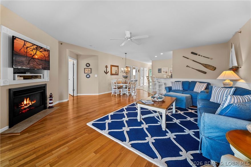 Enjoy easy lakefront living in this beautifully maintained, fully furnished 3-bedroom, 2-bath condo located in a quiet, well-kept complex at the 13-mile marker. This turnkey unit includes a 12x30 boat slip, PWC slip with hoist, and tasteful furnishings—ready for immediate enjoyment. The open-concept layout offers a seamless flow between the kitchen, dining, and living areas, perfect for relaxing or entertaining. The kitchen features quartz countertops, a bar area, and a spacious pantry. Recent updates include a newer HVAC system and water heater for added efficiency and peace of mind. Conveniently located near the elevator and community pool, this unit provides easy access for both owners and guests. Take in peaceful lake views and enjoy direct water access, all while benefiting from low-maintenance condo living. Just minutes from lakefront dining, golf courses, and shopping, this location offers the best of Lake Ozark. No nightly rentals allowed. A nearby garage is available for additional purchase!