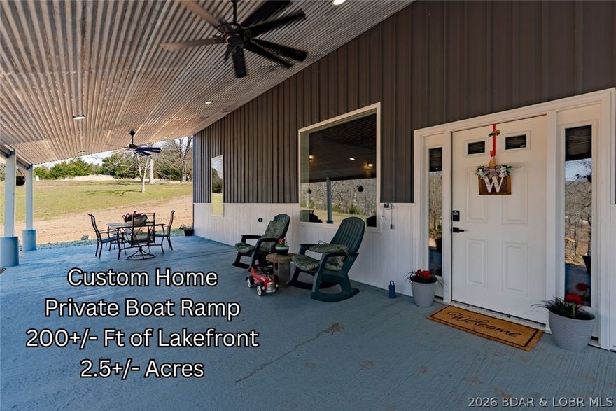 Bring your plans--here's the opportunity! With plenty of room to live, play & invest, this exceptional lakefront property offers quality construction, custom craftsmanship & future potential. Situated on 2+ acres with 200' of shoreline in a quiet cove, this newer home is designed for both enjoyment & entertaining. Open living, kitchen & dining area with vaulted ceilings, loft & stunning floor-to-ceiling pellet stove feature. Custom kitchen has a great pantry closet & coffee bar combo. Classic touches throughout the home. Main level primary suite has walk-in closet, laundry, bath & patio. Custom open stairway leads to family room, 2 bedrooms, full bath & bonus room ideal for office or 4th BR. Attached 800 sf shop/garage adds valuable storage & workspace. Private boat ramp, dock with lift & more dock permit possibilities. The acreage & lakefront layout offer outstanding development potential with room for possibly three additional lake homes, including space for another large waterfront home. A rare chance to own a well-built lakefront property with fantastic expansion potential. Live in one & develop a set of vrbo homes. Seller's have recently cleared some trees for larger view.