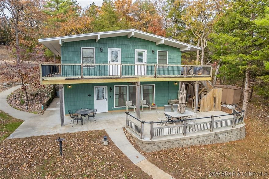 **STUNNING MAIN CHANNEL VIEWS & TIMELESS LAKEFRONT LIVING** Experience classic Lake of the Ozarks living with unbeatable main-channel views, breathtaking sunsets, and endless opportunities for fishing, boating, and swimming. Ideally located just off Hwy MM, this property sits in a desirable neighborhood on an end lot, offering added privacy and plenty of parking for guests. Lovingly cared for by the same family since 1969, this home blends charm with thoughtful updates, including an updated kitchen, bath and Mini-Splits in all upstairs bedrooms. The cozy fireplace is perfect for year-round enjoyment. Extend your living space outdoors to the expansive patio ideal for dining, entertaining, or simply taking in the panoramic lake views. With convenient access to numerous waterfront establishments by both land and water, this property delivers the perfect blend of location, history, and lake life. Whether you’re seeking a weekend retreat, a full-time residence, or investment property this one is for you. * Lot across the road is available for extra $$*