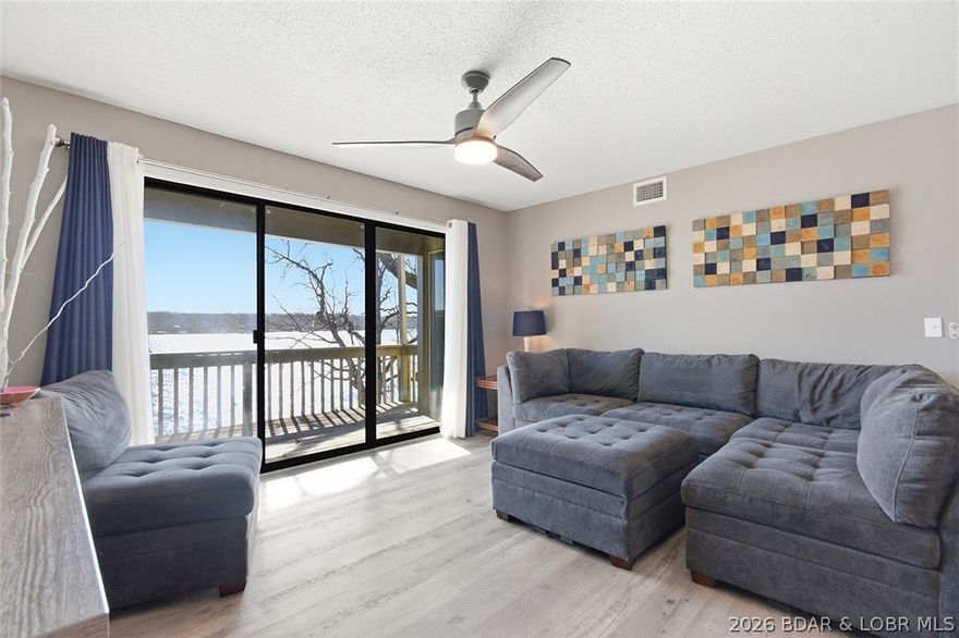 Here is an opportunity to purchase an impeccably maintained and fully furnished 2 bedroom,2 bath, end unit at Pelican Bay Condominiums. This is a walk in level unit with a "Handicap Accessible" ramp. Located at the 26 mm next to Margaritaville, this unit boasts spectacular views of the Main Channel. Unit has newer LVP Flooring, appliances, and recent paint making this unit ready for you to start enjoying immediatley. Outside, the pool and hot tub is just a short walk away with a clubhouse that lends itself well for gatherings such as family reunions or birthday parties. The unit comes with a 24 ft. boat slip and a less than 2 year old 6000# lift. Also available for purchase is a 2008 Famouscraft 24 ft. Deck Boat. This is a highly desireable location here at the lake by land or water, and would make an excellent rental unit. Come check out this unit and see what Pelican Bay has to offer.