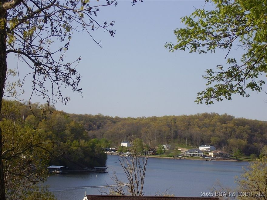 Nice Lake View Building Lot. Utilities above and below the Lot for choice of Home placement. Community Water and Central Septic. Paved Roads and gentle sloping Building Lot. This is a great Subdivision with nice Homes and area well maintained.