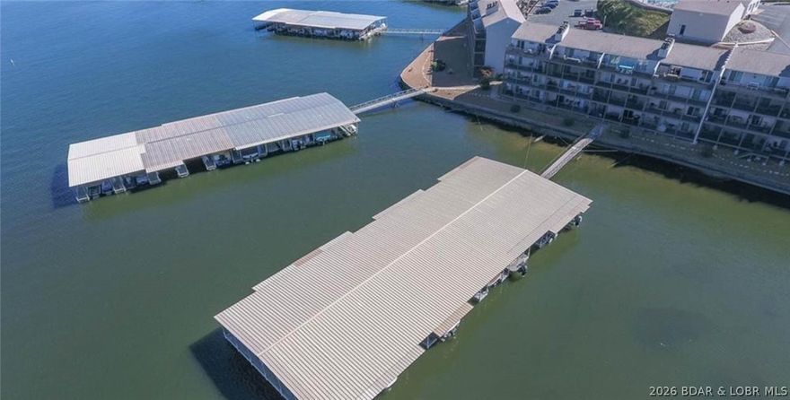 Consider all the boxes checked! Three Seasons Condominiums is perfectly located at the 21MM and within minutes of some of the most popular waterfront attractions, as well as shopping and all of the other amenities that Osage Beach has to offer. This 2 bed/1 bath WALK-IN unit comes fully turn-key with all furnishings, decor, appliances and a TWO BOAT SLIPS included. One slip is 10x24 with an additional 4' roof extension and dock locker, and the 2nd slip is 10x24 with a PWC lift and dock locker. New HVAC system and water heater in 2025 and both sliders have also been replaced! The large deck offers plenty of space for gathering and to take in the beautiful unobstructed lake views. If you're an investor then this condo is perfect for you too! There are no rental restrictions at Three Seasons Condos so this unit could make a great VRBO/AirBnB property. Three Seasons also offers a large pool area, club house, Cable/Internet provided, and has very reasonable HOA dues making this a perfect way for you to start enjoying the lake front lifestyle at a very affordable price point. Call today for your private showing!