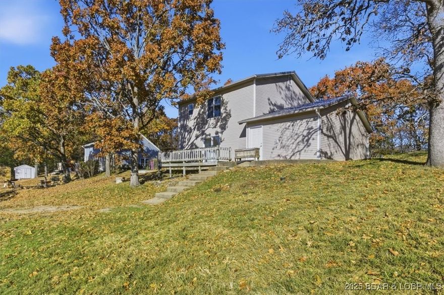 Lovely 3 bed 2 bath Home in an Ideal Location Between Camdenton and Osage Beach! Move in ready with a dependable metal roof! This beautiful home welcomes you with a charming entrance that leads into a spacious open concept living room, dining room, and kitchen. The kitchen features custom cabinets, stainless steel appliances, and an oversized sink, making it a perfect spot for culinary creations. Step outside to the large back deck, ideal for entertaining guests or simply relaxing in the fresh air. Whether you're hosting a summer barbecue or enjoying a quiet evening under the stars, this outdoor space is sure to impress.Don’t miss out on this wonderful opportunity schedule your showing today!