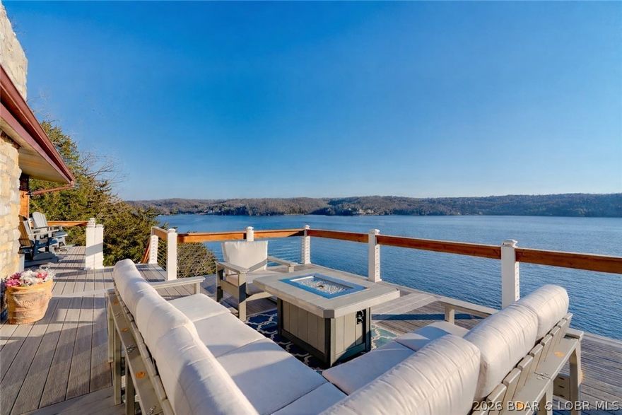 THIS IS LAKE PARADISE! MILE WIDE VIEW * REMODLED 2025 * SUNROOM * 30x40 SHOP w LOFT * NO NEIGHBORS IN SIGHT  The interior remodel includes new LVP, updated kitchen cabinets, quartz island & stainless-steel appliances. The bathrooms feature stylish luxury touches w/ distinctive vanities & spa inspired multi-head shower systems designed for relaxation. The spacious master suite is a true retreat designed w/ modern rustic cabinetry, double barn door custom closet, & jetted tub. Take in the BEST SUNSETS on the oversized Fiberon deck that showcases stunning mile-wide views. The open concept lower-level living area boasts plenty of room to entertain w/ a wet bar, kitchenette where you are steps away from the lakeside covered porch. The impressively built 30x40 shop has RV-sized electric doors, premium insulation, efficient heating/AC, bathroom, plus a loft hangout. The 2-well dock includes 8k & 12k lb lifts, swim platform w/ Wetsteps ladder, high dive & slide. Add in a scenic firepit area, extra acreage and the rare luxury of not a neighbor in sight, all while being close to favorites like Big Dick’s and Boondockz.