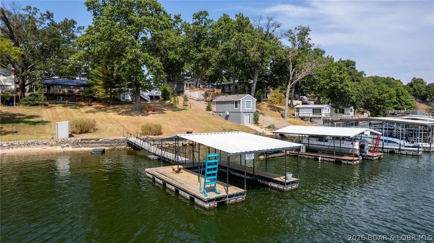 Lakefront Cabin Located at the 47 MM under $350k with Main Chanel Views!! Enjoy lake life at its best with this charming 3-bedroom, 1-bath cabin. This darling cabin comes completely furnished. Inside, you will find a recently remodeled bathroom & newer light fixtures. A durable metal roof adds peace of mind for the years to come. The dock features new wet steps & updated electrical. Whether you are searching for a weekend retreat, vacation rental opportunity, or full-time residence, this home delivers both comfort and convenience in a true lakefront setting.