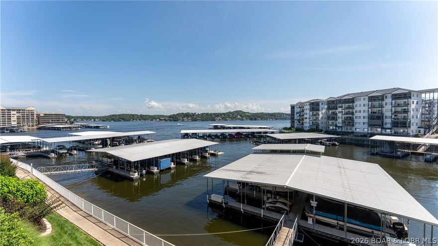 This SUPER NICE 3BR, 2.5BA condo offers the space, comfort, and views you’ve been waiting for! Experience the difference a generous 1,400+ sq ft floor plan makes—perfect for hosting family and friends who will want to extend their stay! As a highly desirable end unit, enjoy an abundance of natural light streaming through additional side windows. The updated kitchen features granite countertops and opens seamlessly to the living and dining areas. The lakeside primary suite is a true retreat with a spa-style bath complete with jetted tub, walk-in shower, and walk-in closet. Relax for hours on the deck taking in spectacular main channel views. Owners and guests love Monarch Cove for its resort-style amenities including three pools, hot tubs, outdoor kitchen, elevators, lush grounds, and a scenic shoreline walking path. New HVAC in 2021. Turnkey package includes furnishings, 12x32 boat slip with 4,000 lb lift, and a PWC slip—an easy way to get started at the Lake! Ideally located at the 2MM by water and just off Duckhead & HH by land—only minutes to Hwy 54 and the Bagnell Dam Strip area, with convenient access to popular lakeside restaurants.