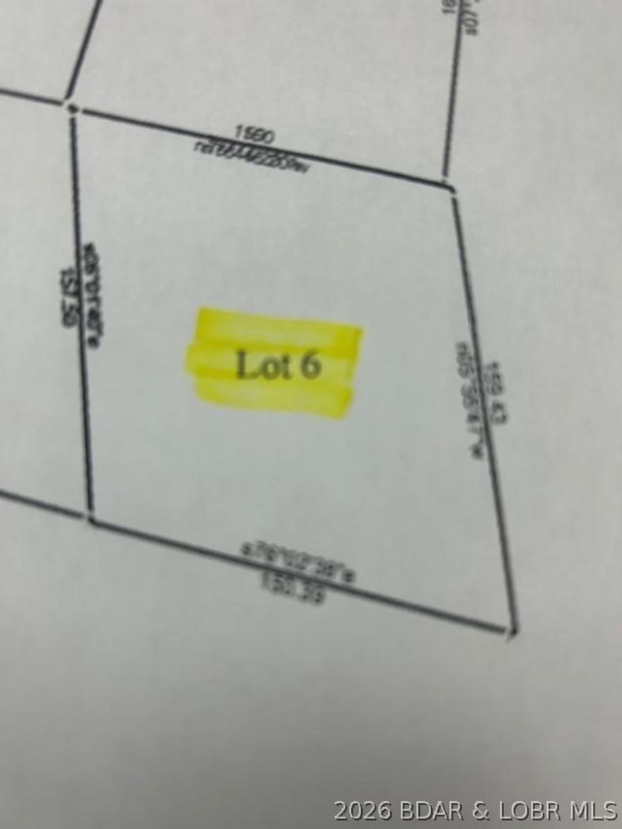 Gentle lake access lot located in Johnsons Bay. This sight would be good for a 1 story or possibly a walk-out ranch style home. This area is served by Central States Water Resources. There is a hookup fee TBD by the supplier.  Monthly fees currently are $27 for water and $47.50 for sewer.  There is a common lake front area by the community boat dock that has a boat ramp for your lake access. Very reasonably price with the ability for your water & sewer hookups! The homes in the area are moderate to high end. Come take a look. Multiple lots available or buy the group of 4.