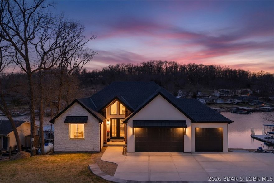 Your dream Lake House is now a reality. New Construction, Lake Front, Big views, Large Deep Water/No Wake Cove, Custom Detail throughout and to top it off... an In-ground Pool! This stunning home at the 11MM of the Osage will wow you from entry to lakeside.  5 bedrooms, 5 full baths, custom cabinetry with meticulous attention to detail throughout. The open floor plan features vaulted ceilings, and expansive windows. The living room features a grand custom plastered gas fireplace and exquisite hardwood flooring. The gourmet kitchen will not disappoint, boasting a 10' island, beautiful quartz counters & backsplash, custom plastered range hood, walk in pantry and high-end appliances.  The main level offers the lakeside primary suite which features fabulous wall/ceiling detail, a spa-like bath, and a large walk-in closet. The lower level includes a family room, 3 additional bedrooms/bathrooms (2 ensuites), a full wet bar area, a wine room and an additional laundry space.  In addition, there is a safe room and ample storage. Drive your golf cart from the driveway to poolside/dockside and then park it in its very own lower-level golf cart garage.  Plenty of entertaining space here.