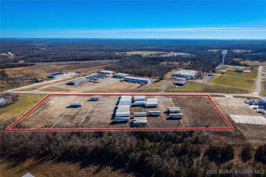 Excellent development opportunity with this approximately 6.5± acre tract (subject to survey) located immediately off Interstate Hwy 54 in Eldon’s Industrial Park. This flat, highly usable parcel offers multiple points of access from Industrial Parkway, providing outstanding circulation and visibility for commercial or industrial operations. Currently utilized for box trailer parking, the property features existing concrete footings in place for trailer landing gear, allowing for immediate functional use. With access to city water and sewer, the site is well-positioned for build-to-suit development, expansion, or continued transportation and logistics operations. Ideal for investors, developers, or owner-users seeking a strategic location with strong infrastructure and convenient interstate connectivity. A rare opportunity in one of Eldon’s most accessible industrial corridors.