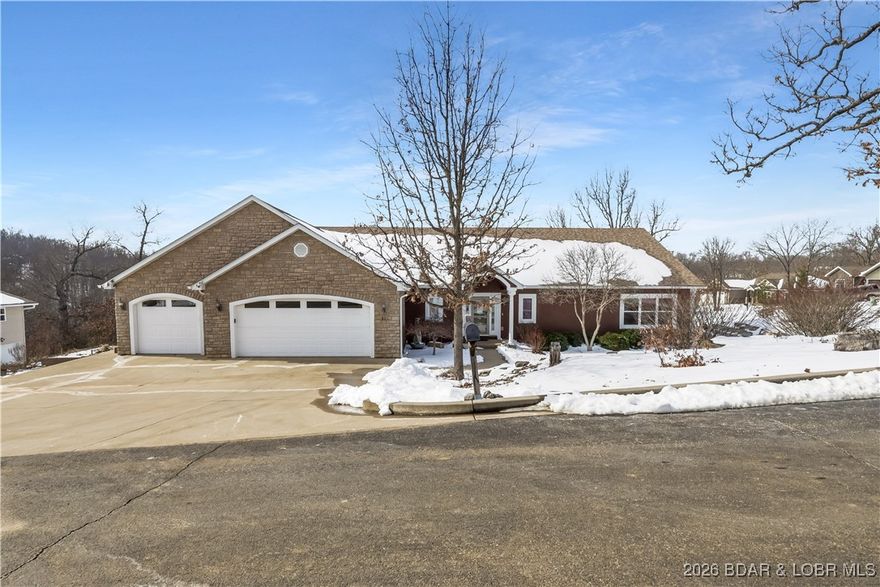 Ranch-style home in Linn Creek offers easy one-level living, lake access, POA fishing pond, over 3 acres of privacy & possibilities! You'll appreciate the custom finishes & upgrades throughout this spacious 4-bedroom, 3.5 bathroom home. The home features main level living with a large master bedroom & bathroom en-suite. Guest bedrooms on the opposite side of the home with shared bath in between. Large open floor plan that walks out back to a sprawling upper deck. As you head downstairs you'll find a second living area, guest bedroom & full bath. An incredible storage space tucked back in the lower level as well. Heading outside you'll find a massive, detached workshop that includes a lofted flex area & half bath- perfect for business or storage. Enjoy the water with Lake Access nearby on the community dock, or at the community pool within walking distance! The purchase also includes a 12x30 dock slip in the community dock along with a 6,000 lb lift for a pontoon or V bottom boat. Combining privacy & functionality, this central Lake of the Ozarks location provides the best of offshore living with full lake amenities! This home is a simply *Must See*, call to schedule your tour today