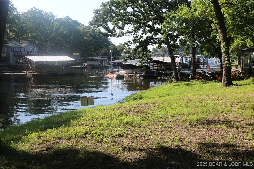 Highly desirable O road and Morgan County location. Quiet cove location on this big lot and very gentle at water's edge. Survey, approved dock permit, soil evaluation, engineering and sewer permit and house plans all on file. Excellent value for saving time, aggravation and due diligence. This prime Morgan County lakefront lot provides rare opportunity at the lake with no planning and zoning and no HOA restrictions