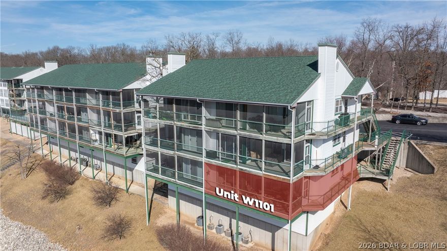 What a view—this is lake living at its best! This 3-bedroom, 2-bath end-unit at Hilltop offers exceptional privacy with a rare setting beside a wooded common area—no neighboring decks or dock rooftops in sight, just breathtaking views of the Lake of the Ozarks.

Offered fully furnished, this well-maintained condo features a lakeside primary suite with private bath and walk-in closet, an open living space with breakfast bar, 6-panel doors, and a screened-in deck perfect for relaxing or entertaining. A 12’ x 28’ boat slip is included, making it easy to get out and enjoy the water.
Convenience continues with one assigned parking space, ample guest parking, and a flat parking lot—plus close proximity to the Hilltop pool and tennis court.
The amenity package truly sets this complex apart, offering two heated pools, clubhouse, walking trails, tennis court, playground, designated pet area, lakeside boardwalk, concrete wave-break, weekend summer security, and both long- and short-term boat trailer parking.
Ideally located just minutes from Bagnell Dam Boulevard, you’ll have easy access to shopping, dining, nightlife, boat rentals, parasailing, and everything the Lake has to offer.