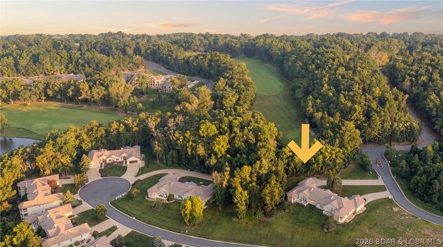 Priced to sell!  Welcome Home to the newest listing in the gated community of Magnolia Point at Porto Cima, one of the most sought-after lake communities.  This section of luxury townhomes features expansive one level living nestled adjacent to the award winning championship golf course @ the 8th tee box with lake views - a quiet setting for year-round enjoyment!  This remodeled villa will capture your interest before you even step inside with the well maintained exterior, long driveway, and recently added landscaping!  The interior of the home is immaculate with walls of windows, tall ceilings, very spacious bedrooms, an open kitchen w/ modern countertops, screened in patio + uncovered patio area as well!  Flawless maple kitchen cabinets, slate counter tops, designer appliances, tile flooring, custom built-ins surrounding the fireplace, The photos speak for themselves but come experience luxury living at the lake where the beauty of the Ozarks does not come at the expense of quality of life and conveniences - you'll get the best of both worlds here!