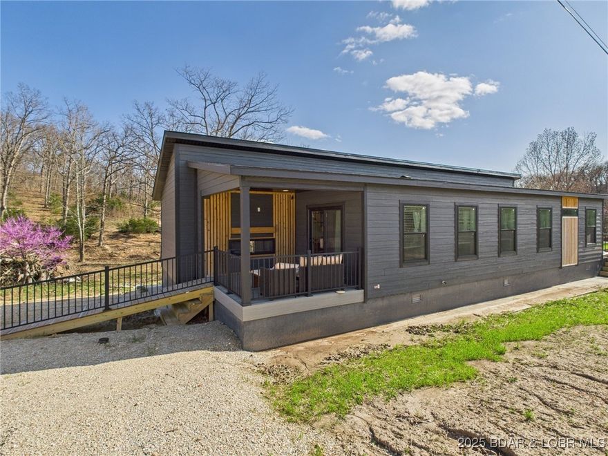 Brand New, Low-Maintenance Living Near the Lake
Experience the best of Laurie in this brand-new 2024 build in Woodhaven Estates. Perfectly designed for first-time buyers or downsizers, this single-level home offers 1,413 sq. ft. of modern, open-concept comfort just minutes from Lake of the Ozarks fun. 
Modern Interior: 3 bedrooms and 2 full baths featuring luxury vinyl plank flooring throughout.
Modern Kitchen: Custom cabinets, a large island, and sleek stainless steel appliances.
Primary Suite: Spacious retreat with double sinks and an upgraded walk-in shower.
Outdoor Living: Large front deck with a cozy outdoor fireplace — perfect for morning coffee or evening cocktails.
Prime Location: Situated on a gentle 0.38-acre city lot within the Camdenton School District, with groceries and lake access just around the corner. 
Energy-efficient and move-in ready — start your lake-area lifestyle today!