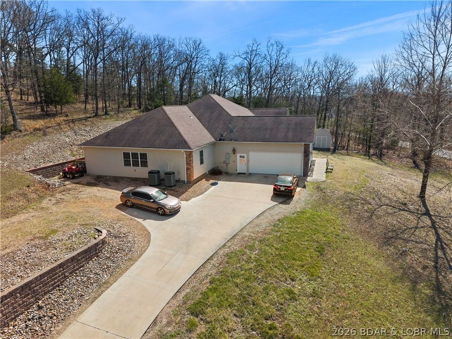 Welcome to your perfect Lake of the Ozarks retreat! This beautifully maintained 5 bedroom, 3 bathroom ranch-style home offers 3,600 square feet of comfortable living space in a peaceful neighborhood with NO HOA. Designed with both relaxation and entertaining in mind, the spacious layout features three separate family rooms, giving everyone plenty of room to gather or unwind.

The large kitchen is a true centerpiece, complete with a bar top for casual seating and a pantry for added storage. Step outside to enjoy the cozy patio—ideal for sipping your morning coffee while taking in the serene surroundings and lake views. The home also boasts beautiful curb appeal and a storage shed for all your extra needs.

Located just minutes from the Bagnell Dam Strip, you’ll have quick access to dining, shopping, and entertainment while still enjoying the quiet side of the lake. Whether you're a first-time homebuyer or looking for a family-friendly space to grow, this move-in ready home checks all the boxes. Come experience the charm, space, and convenience this property has to offer!