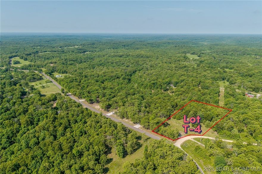 Excellent building lot consisting of 3.01 acres located on Ivy Bend rd (blacktop) just off of Hwy 135. Seller has just cleared all the brush and dirt driveway is in place. Lot is ready to build and has electric poles on property. Minimal restrictions-All lots have been surveyed! Come stake your claim in a 3-acre parcel at beautiful Lake of the Ozarks today!